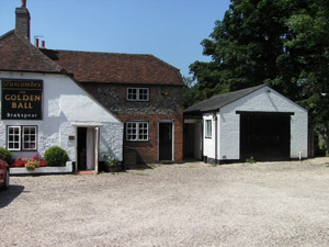 Traditional brick and flint two storey extension to public house